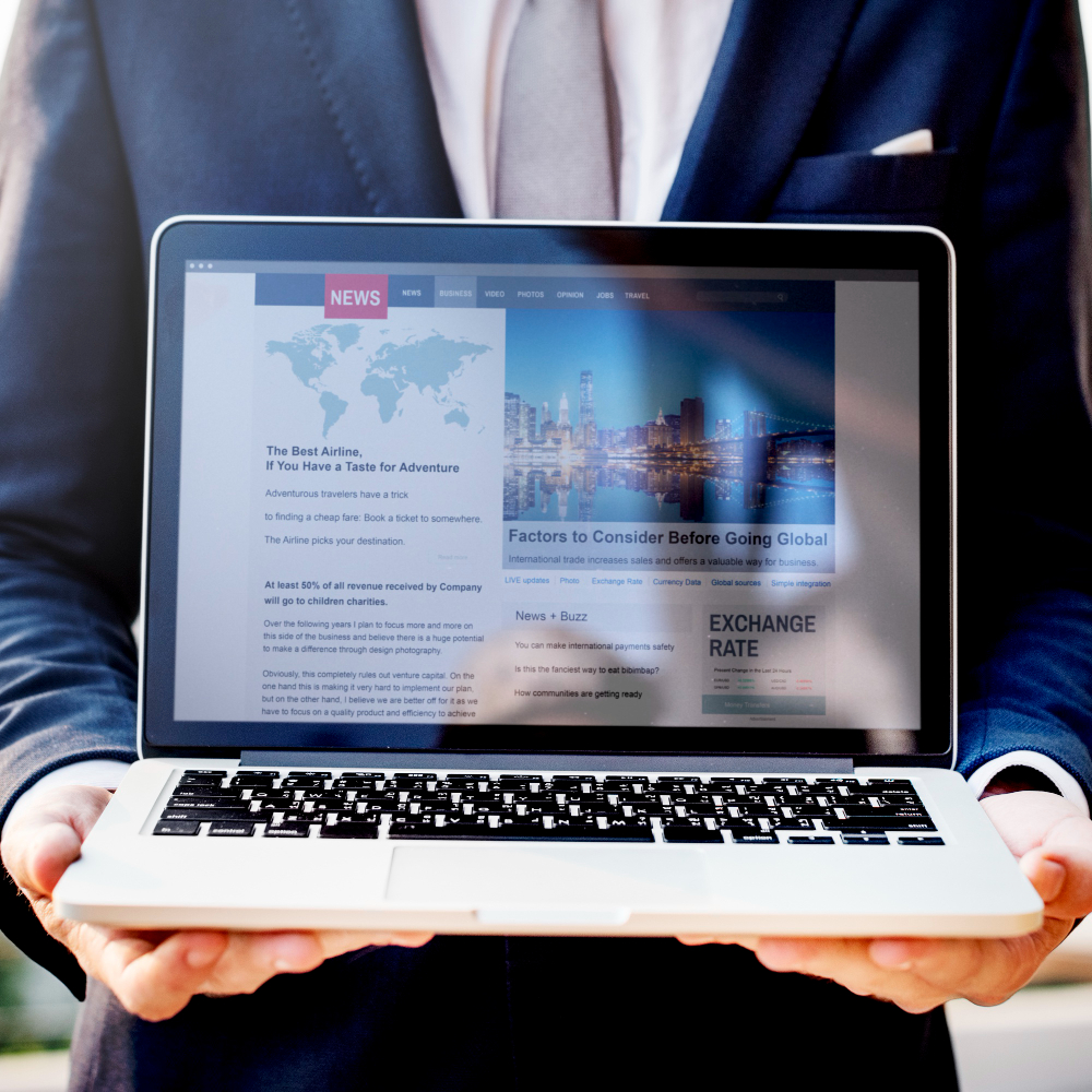 businessman-presenting-news-laptop