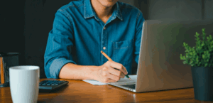 Person typing cold email on laptop